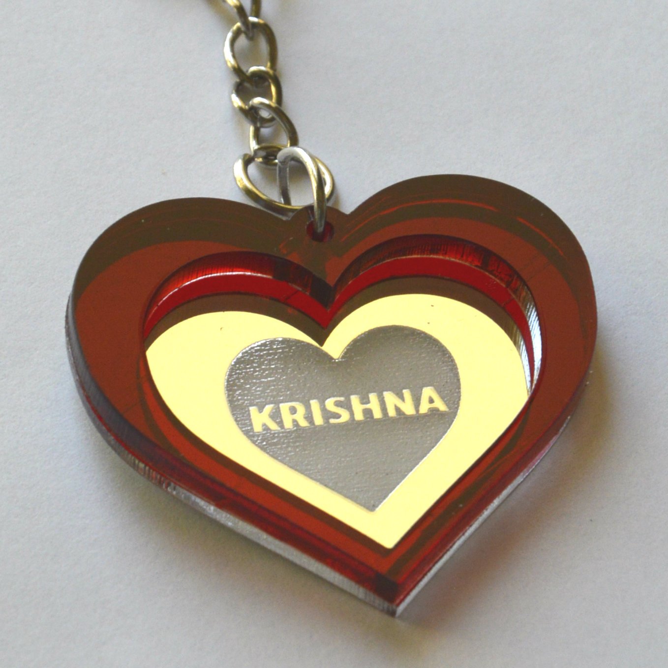 Keychain Krishna Lasercut Heart with red and mirror plastic Laser Cut